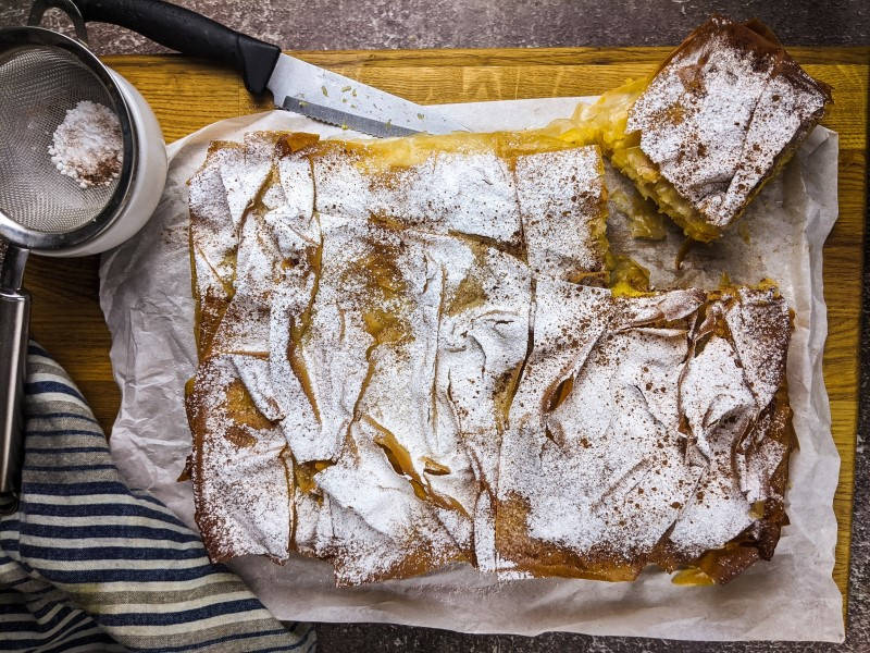 Bougatsa with pumpkin dusted with powdered sugar and cinnamon.