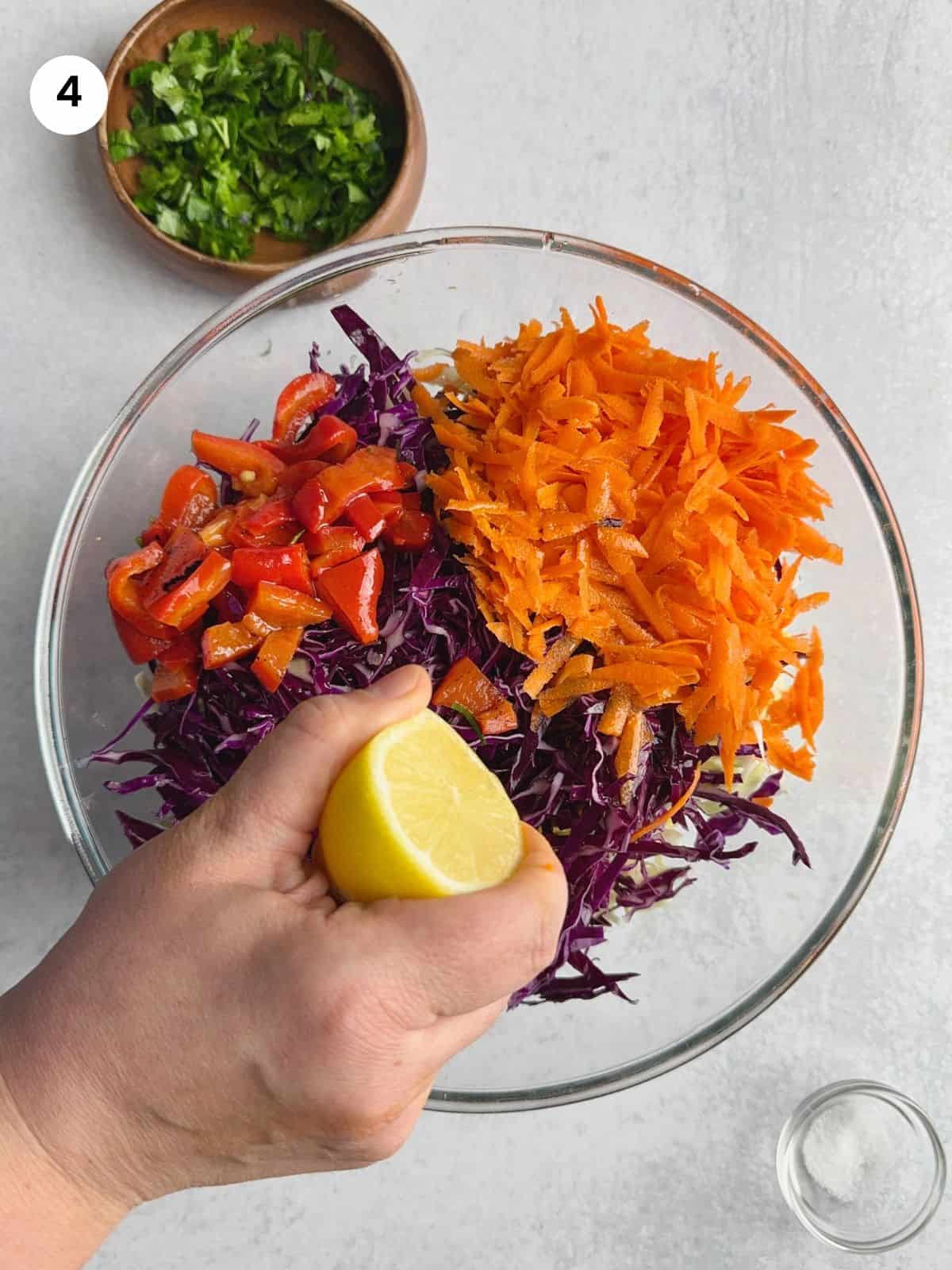 Adding lemon juice to the salad as part of the dressing.