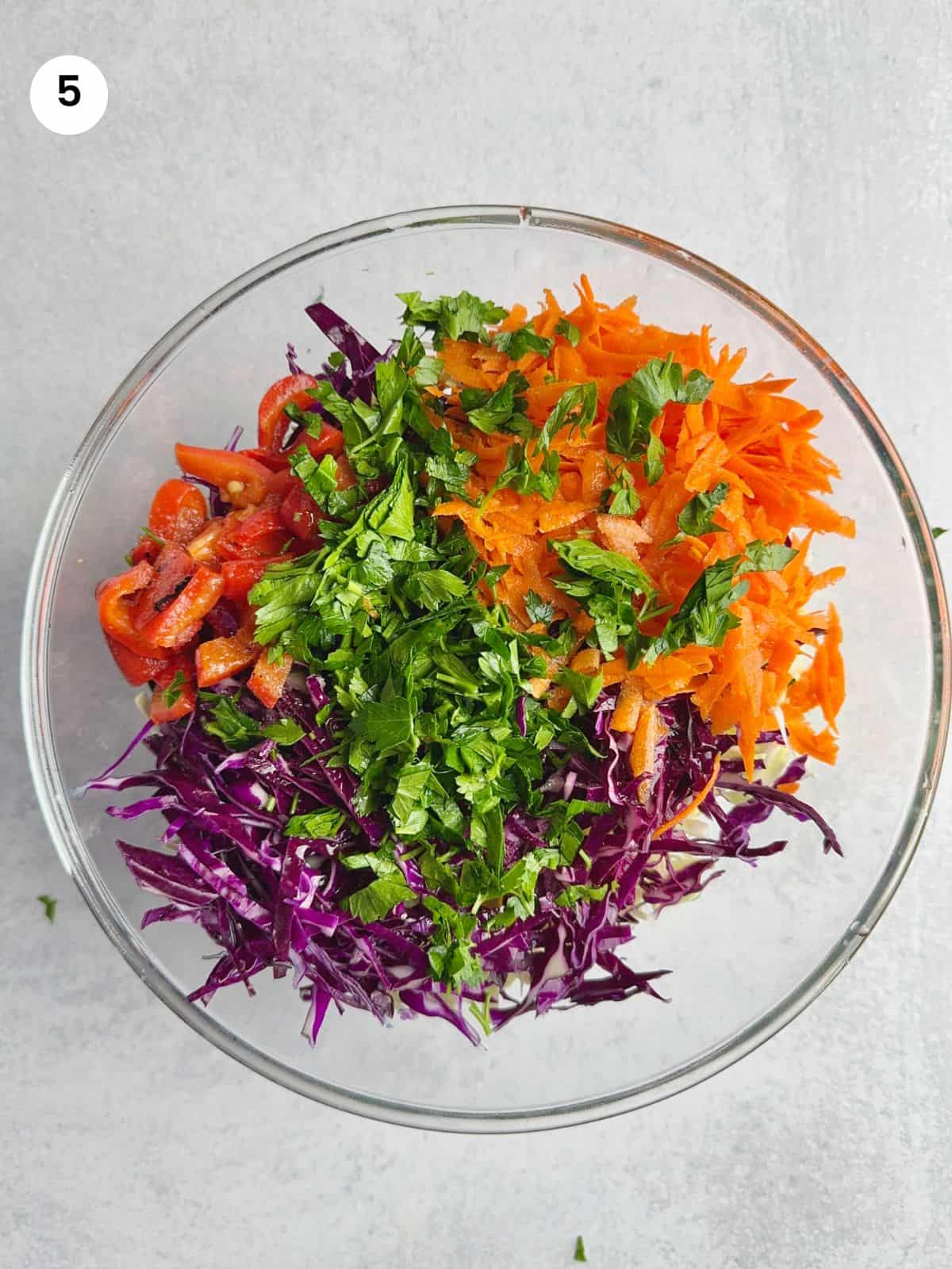 Resting cabbage salad with the dressing in.