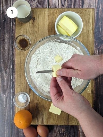 Cutting the cold butter into cubes.
