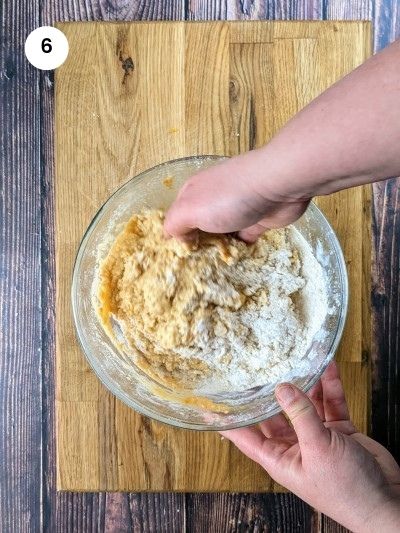 Mixing dry and wet ingredients together.