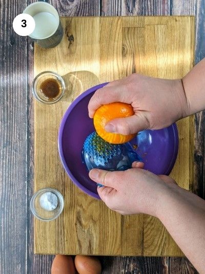 Adding the orange zest to a bowl.