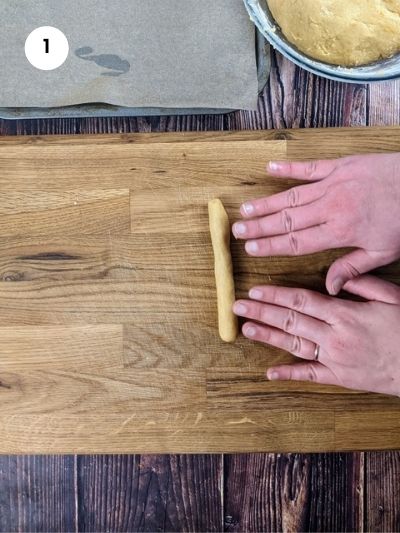 Rolling the dough ball into a rope.