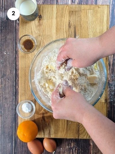 Rubbing the butter with the dry ingredients.