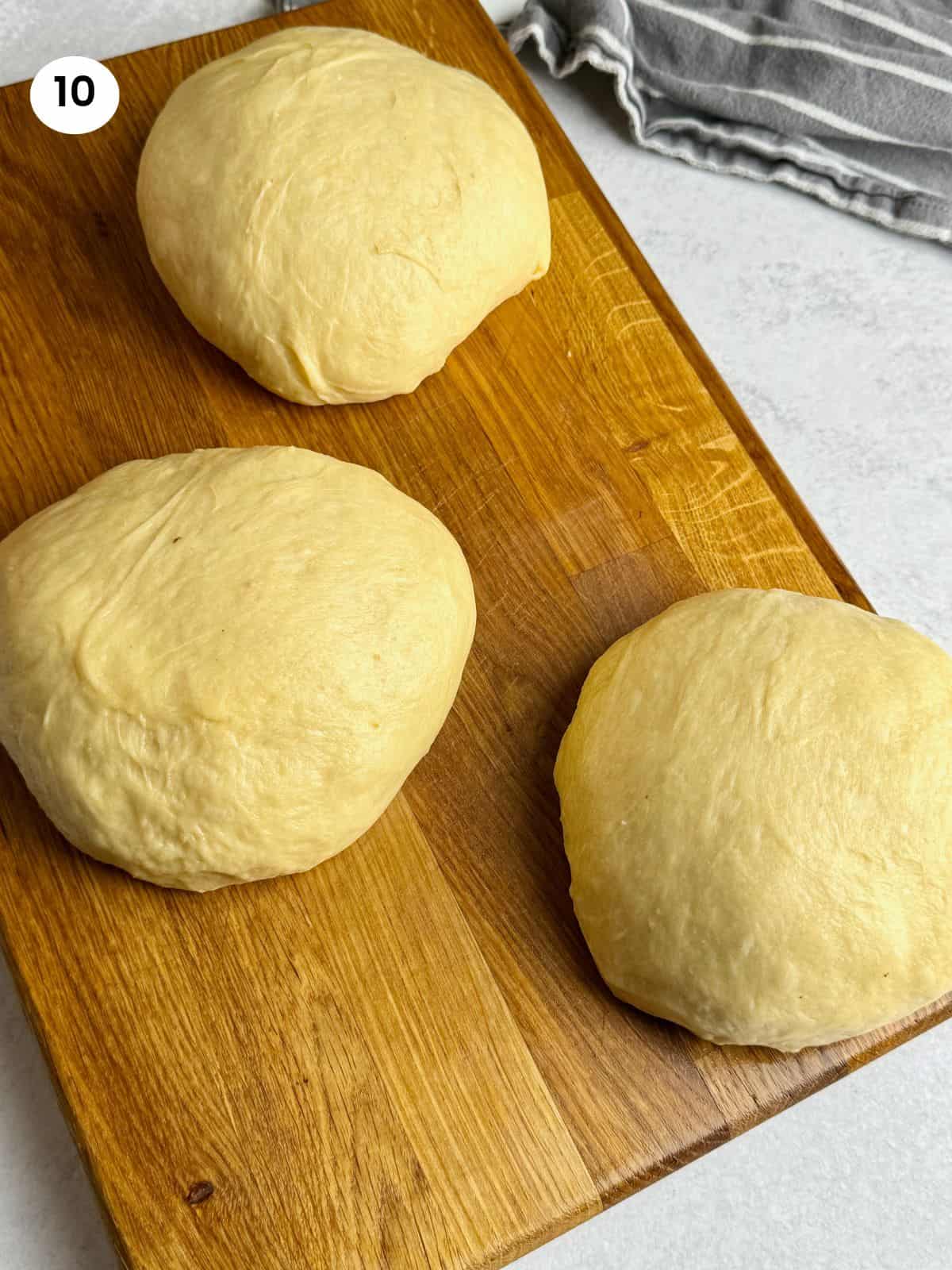 Splitting the dough into 3 big balls.
