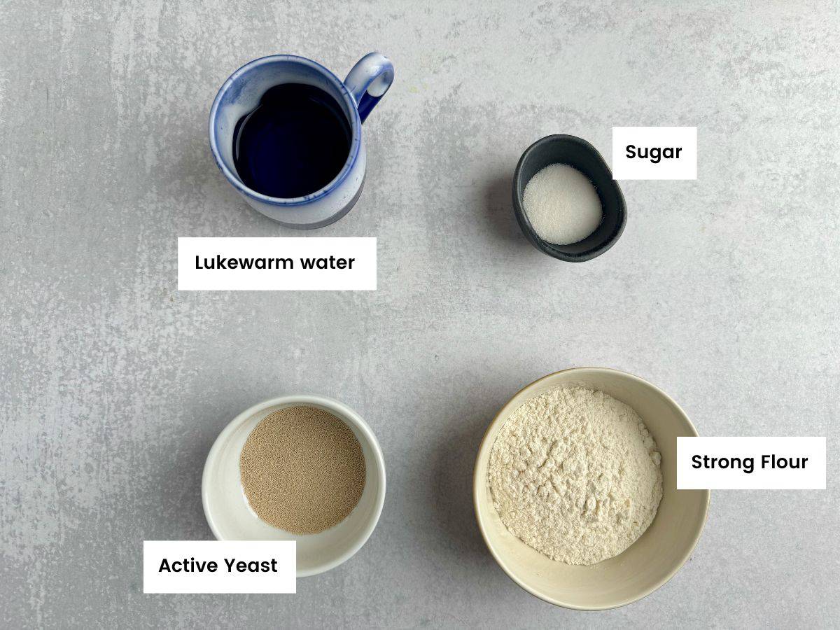 Ingredients for activating the yeast for the tsoureki bread.