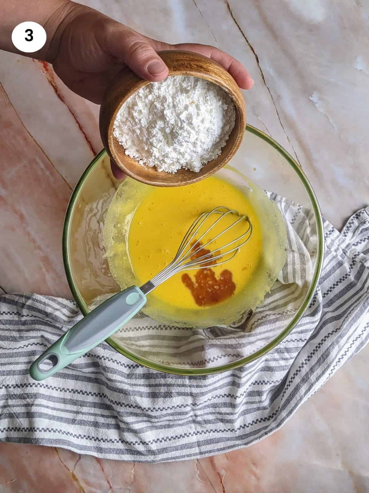 Adding the cornstarch to the mixture.