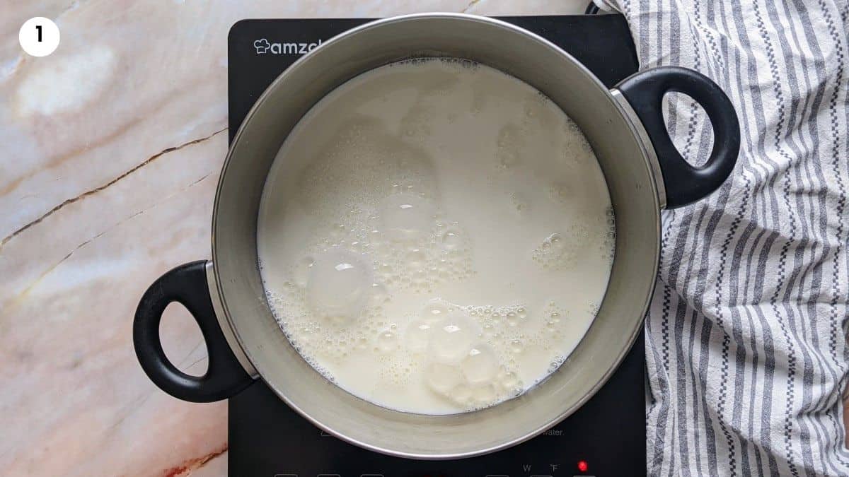 Boiling the milk for the custard.
