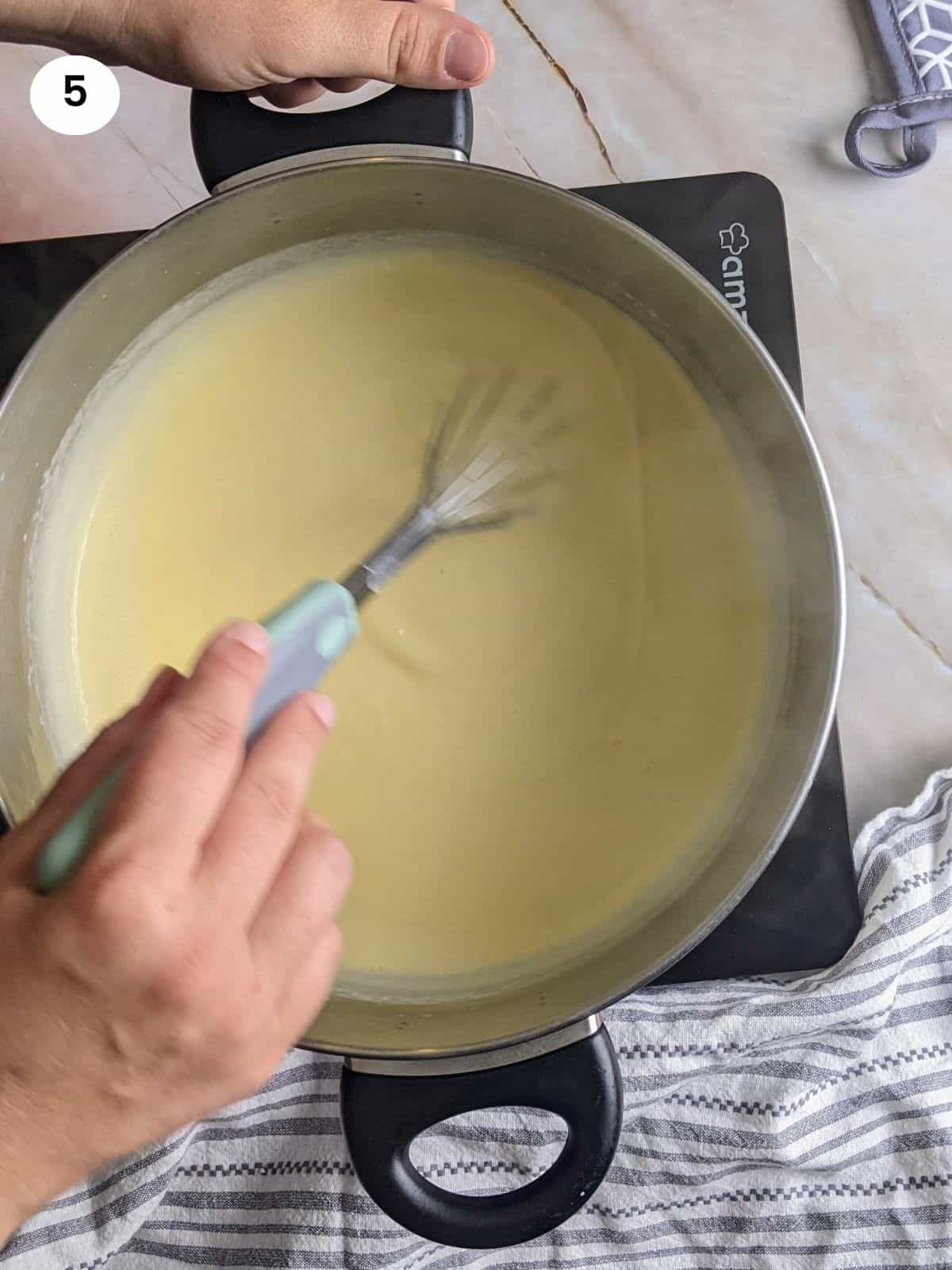 Heating the batter until it becomes custard.