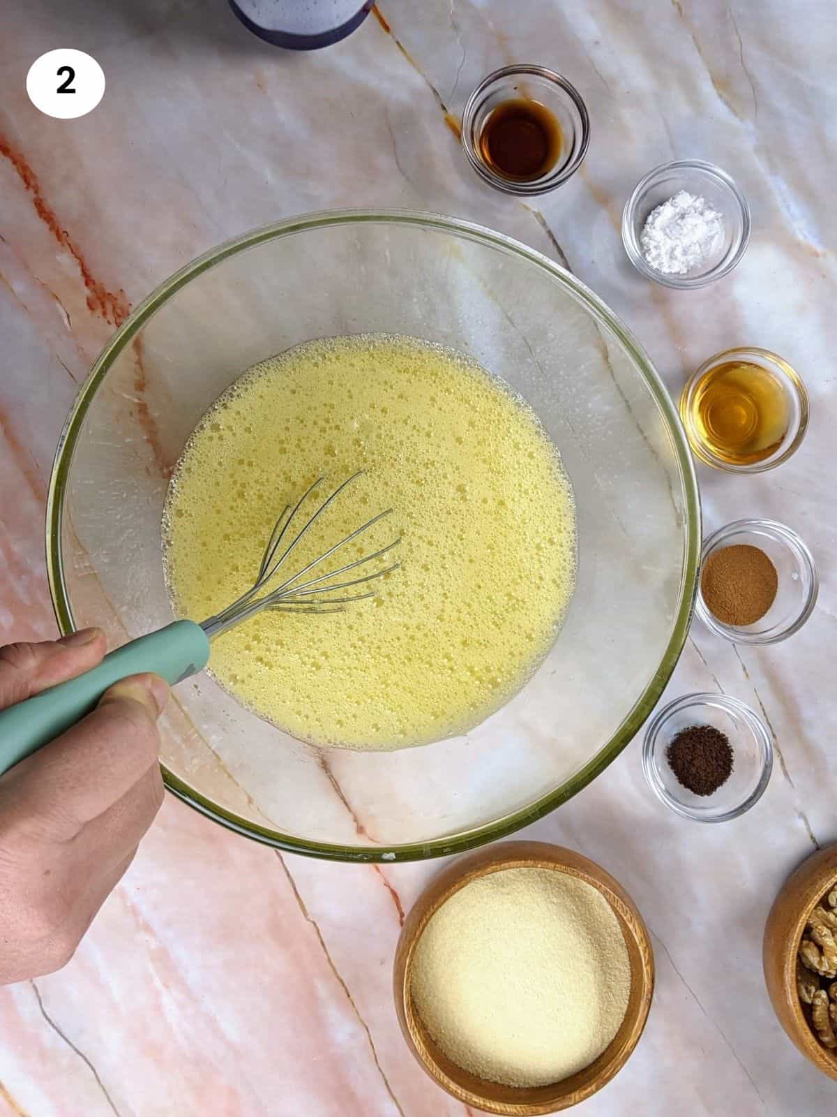 Adding the orange juice and baking soda to the mixture.