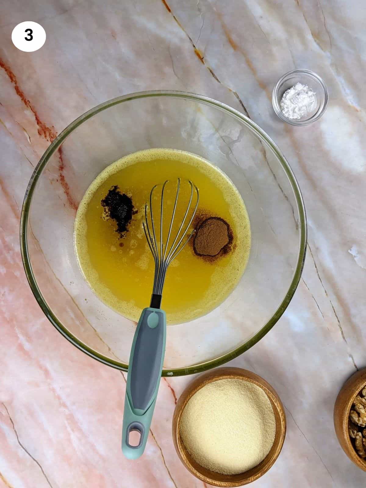 Adding the spices for the Greek honey cookies.