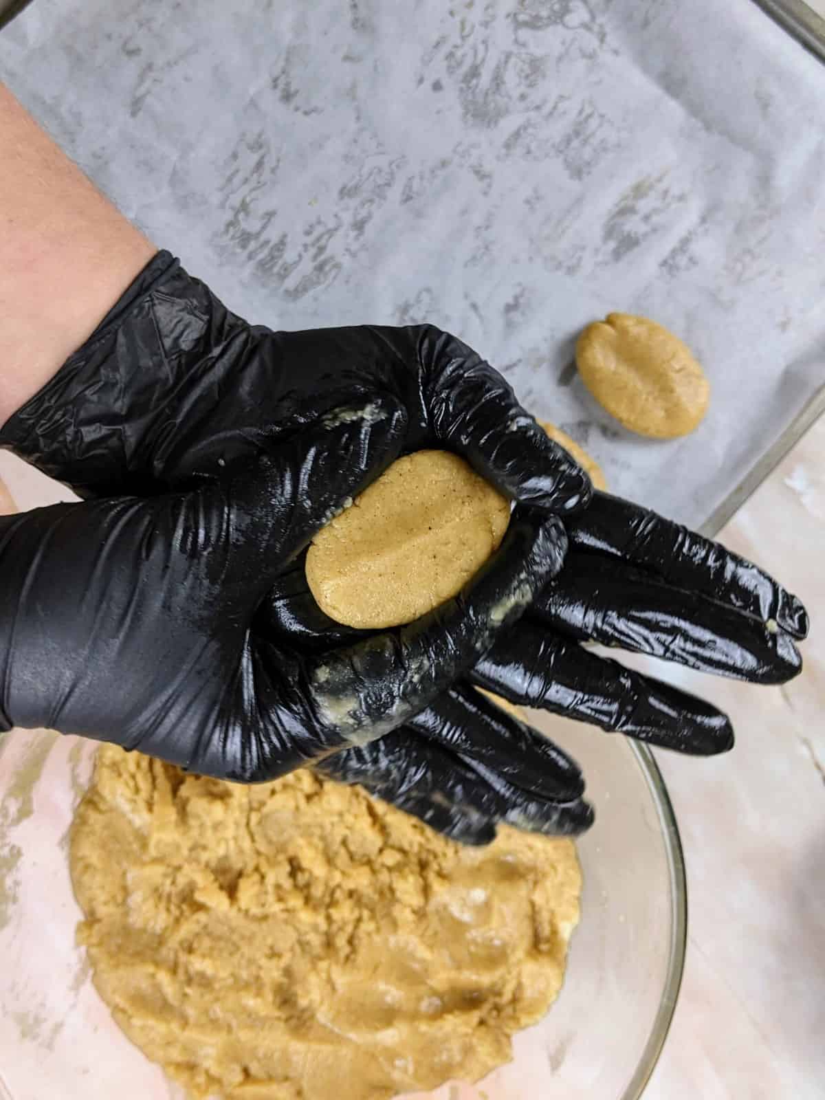 Shaping the dough ball into an oval shape.