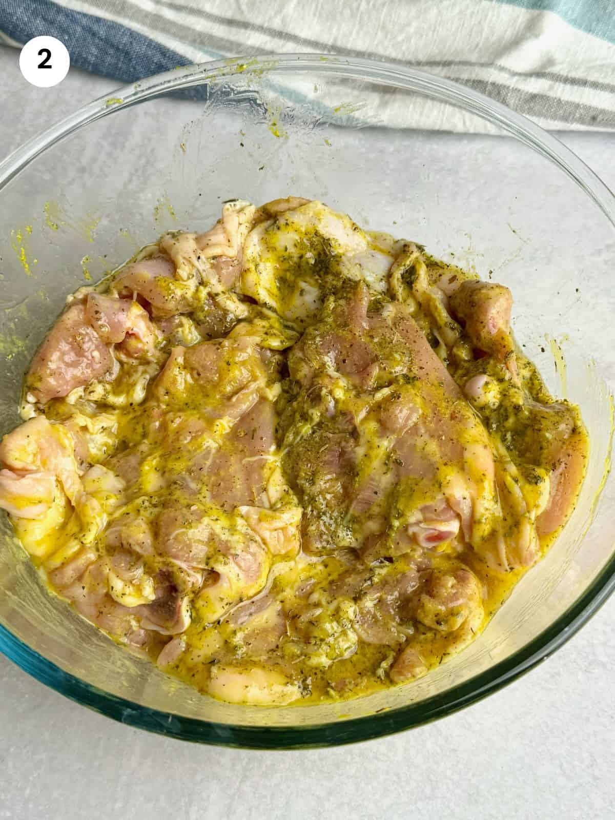 Marinated chicken in a bowl.