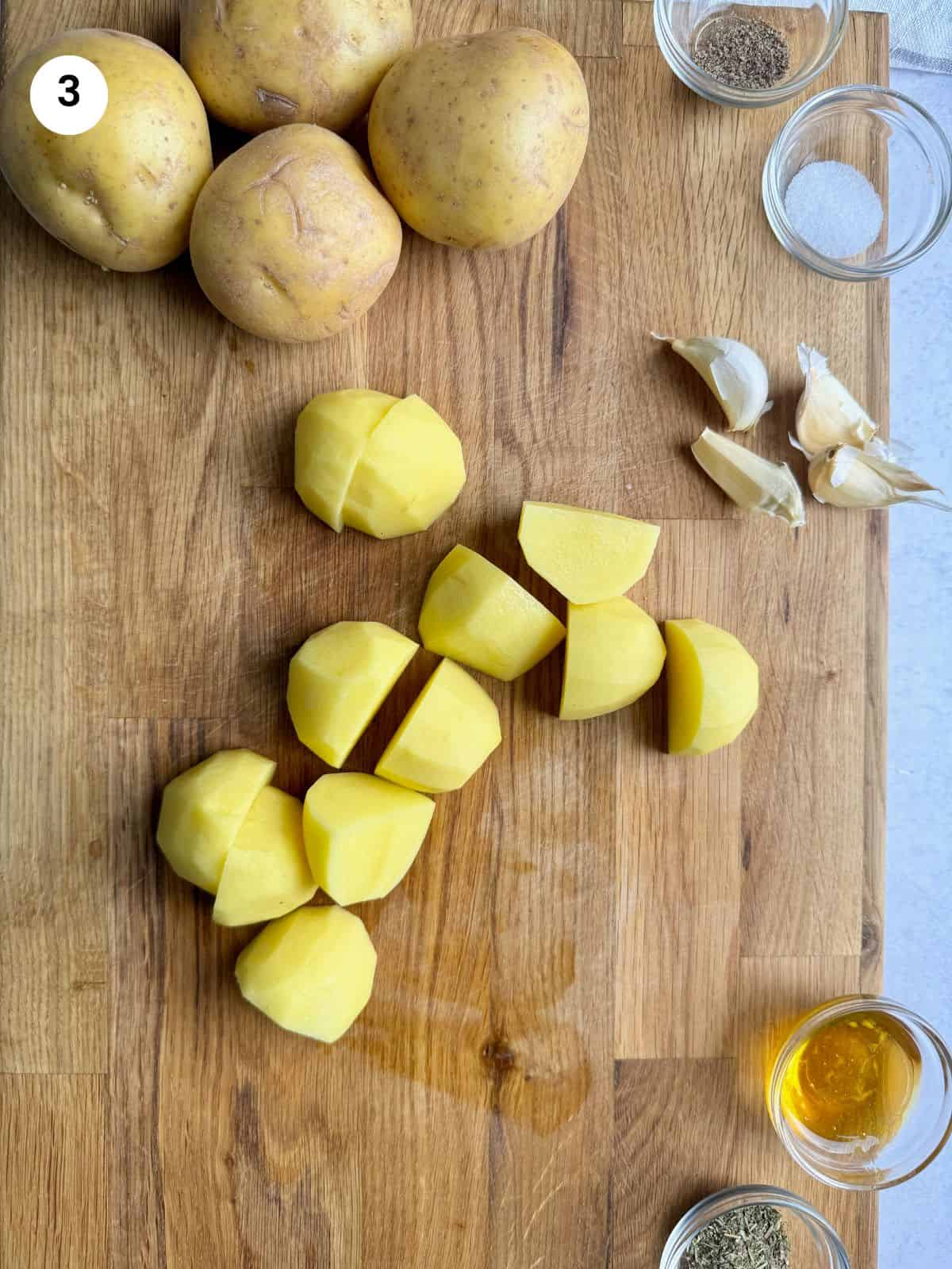 Cutting the potatoes in quarters.