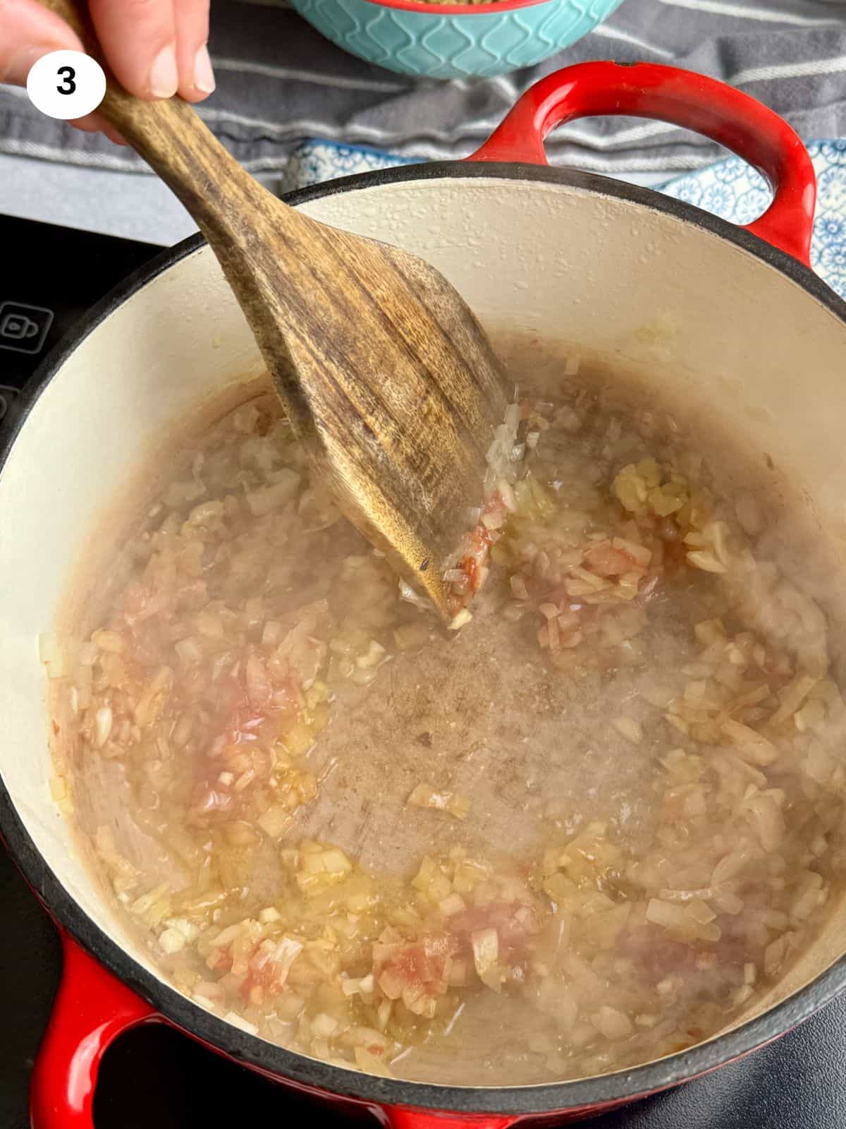 Sauteing the onion, garlic and tomato paste for the lentil soup.