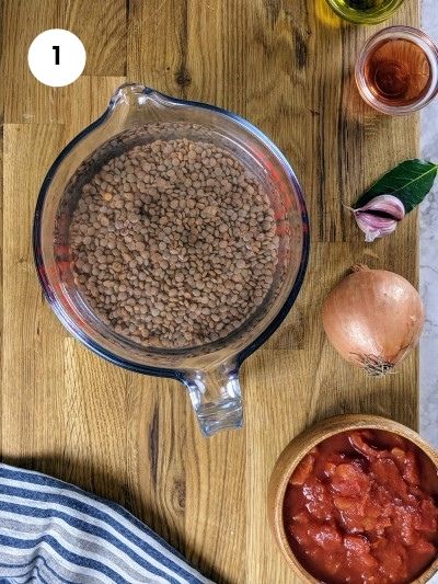 Soaking the brown lentils in water.