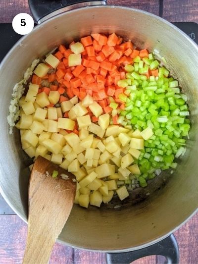 Sauteing the onion and adding the vegetables to the pot.