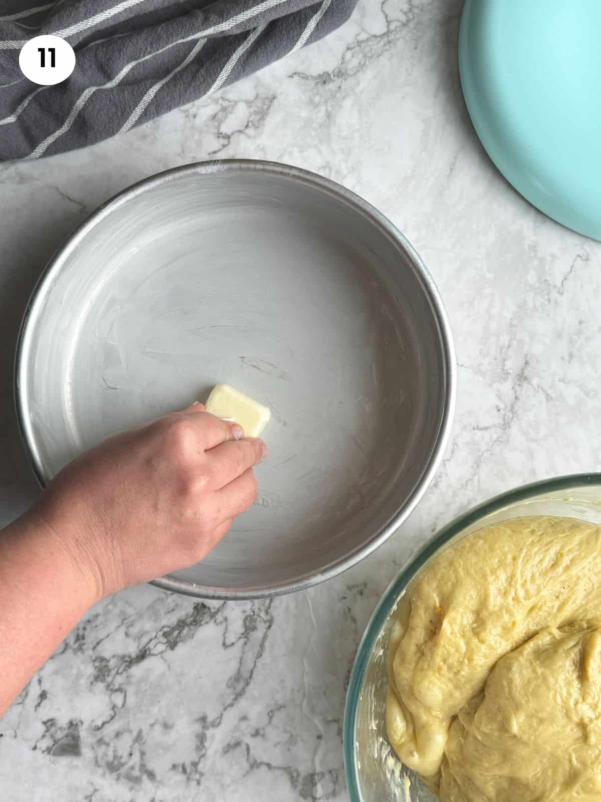 Grease cake pan with butter.