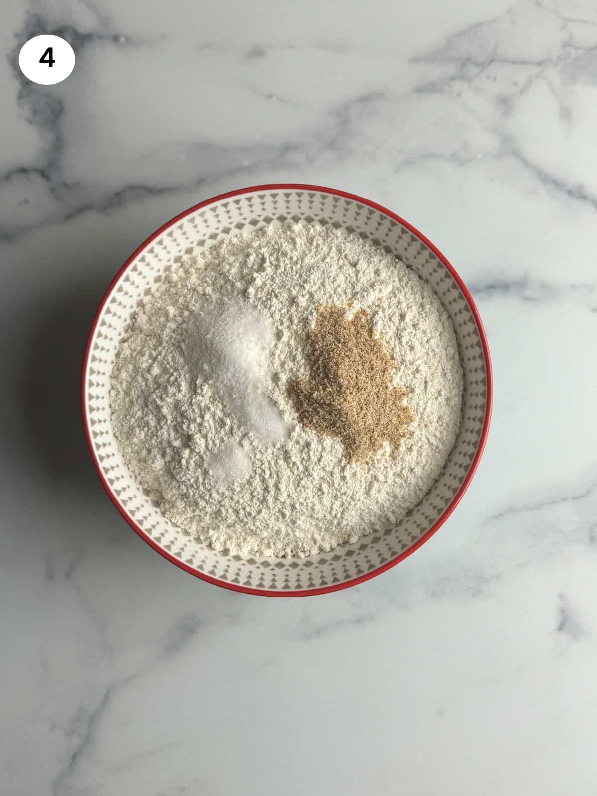 Mixing the dry ingredients in a bowl.