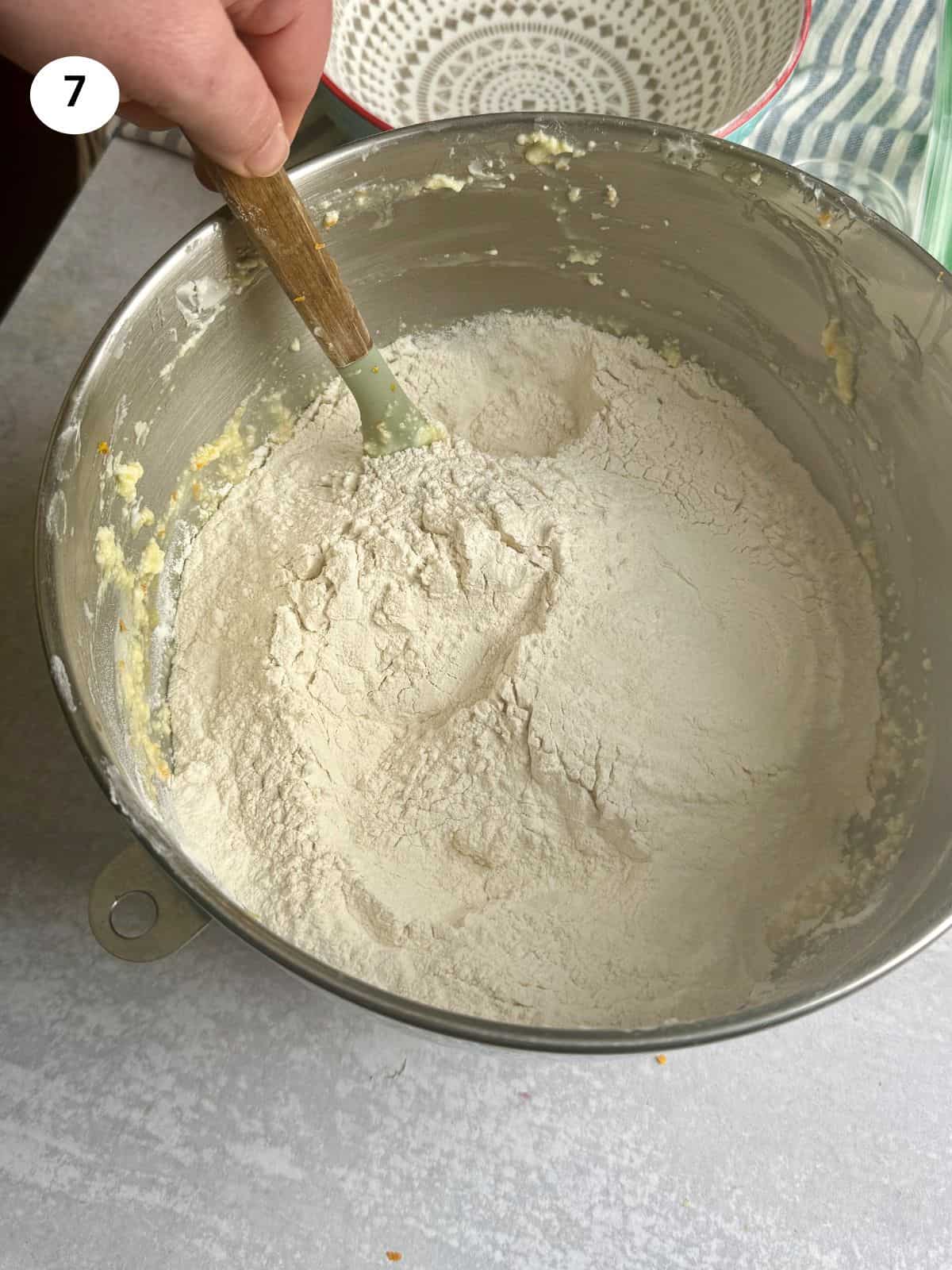 Adding the dry ingredients to the batter and mixing everything.