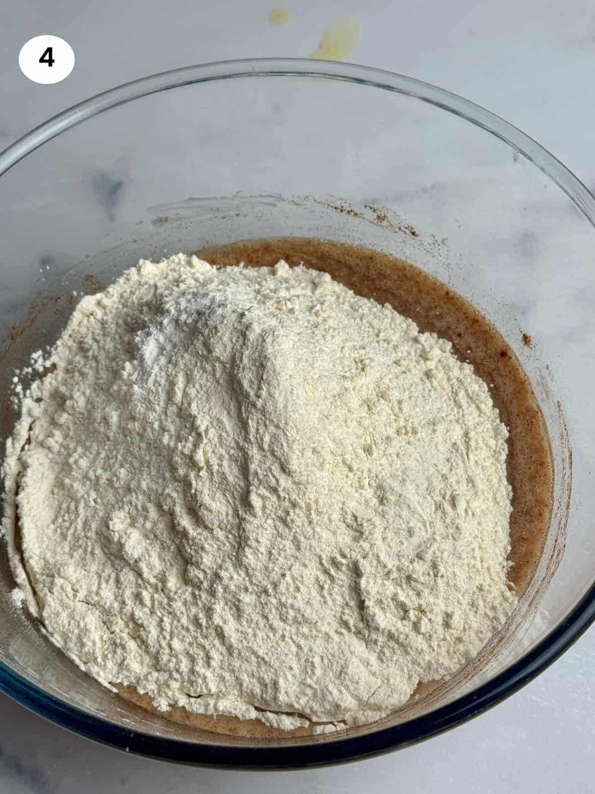 Flour and baking powder added to the bowl.