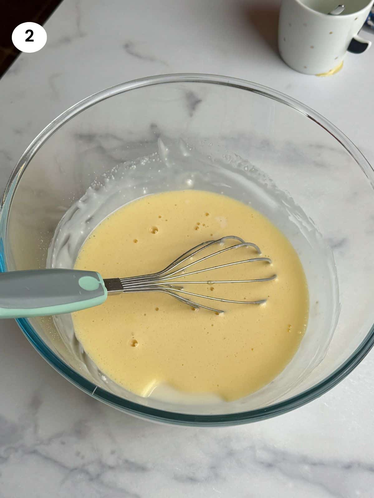 Added the orange juice and baking soda mixture to the bowl.