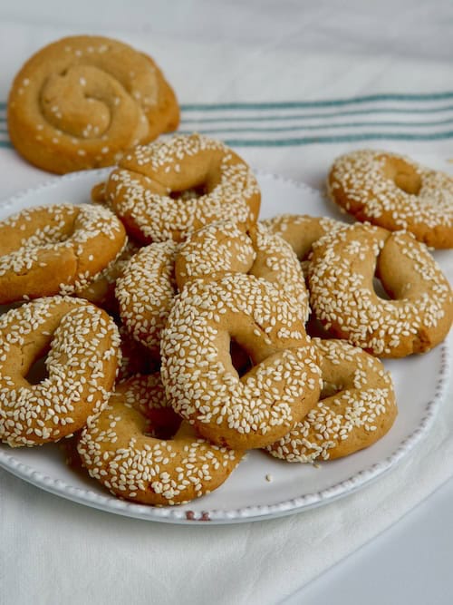 Greek olive oil cookies on a white plate. Greek olive oil cookies on a white plate.