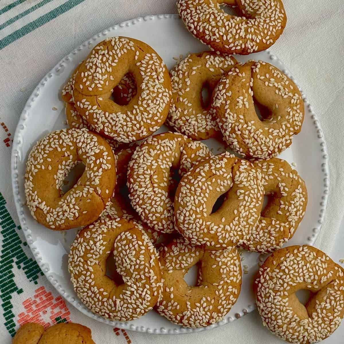 Greek olive oil cookies on a white plate.