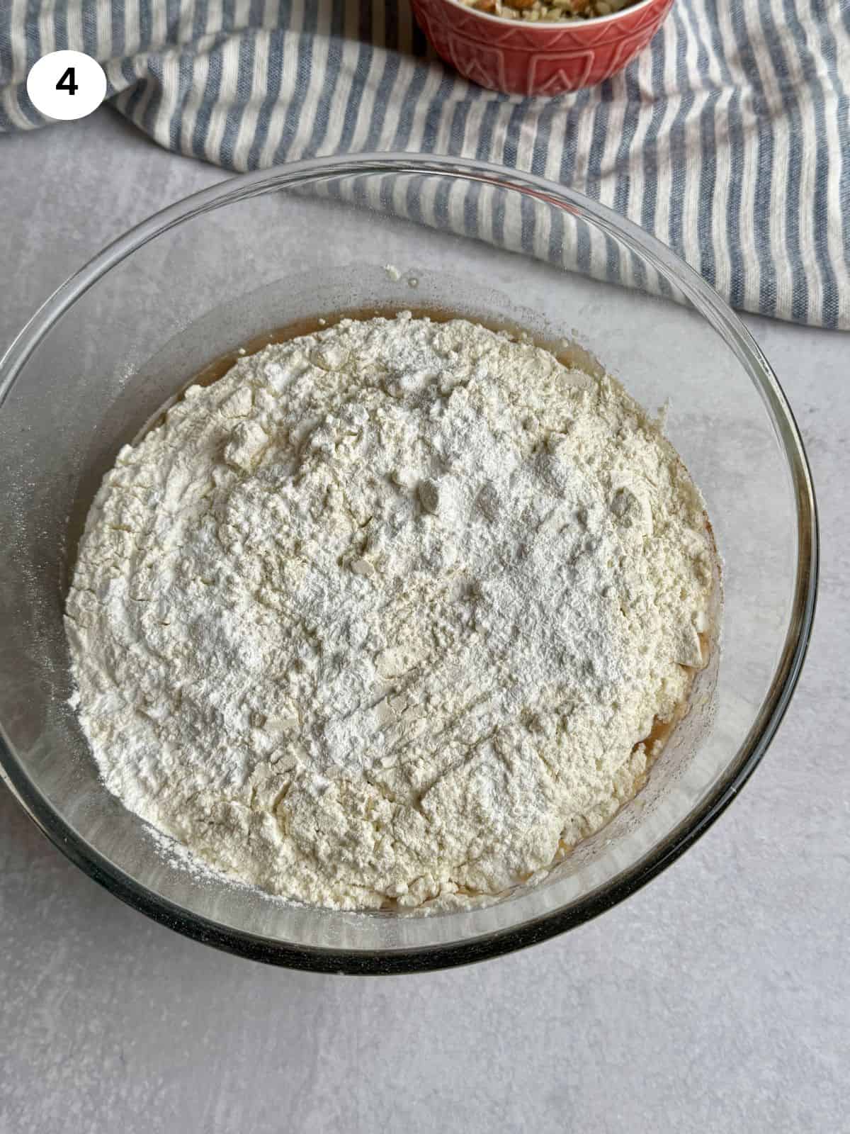 Flour and baking powder added to the bowl.