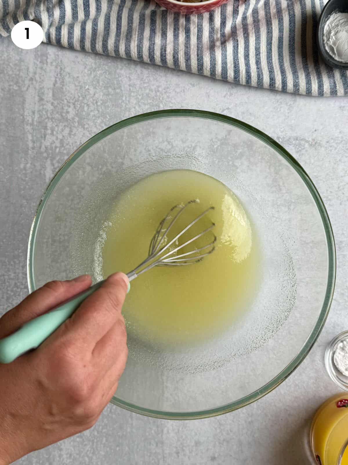 Mixed olive oil and sugar in a bowl.