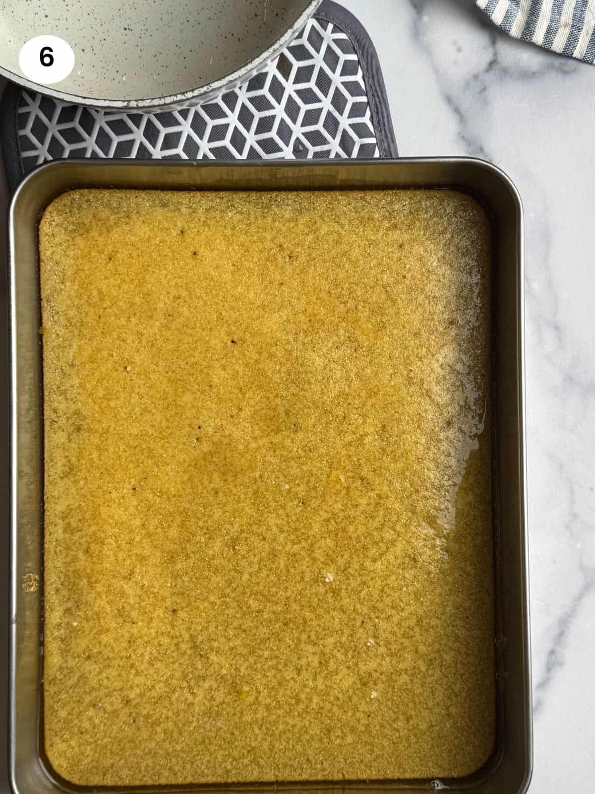 Semolina base after syrup is poured over.