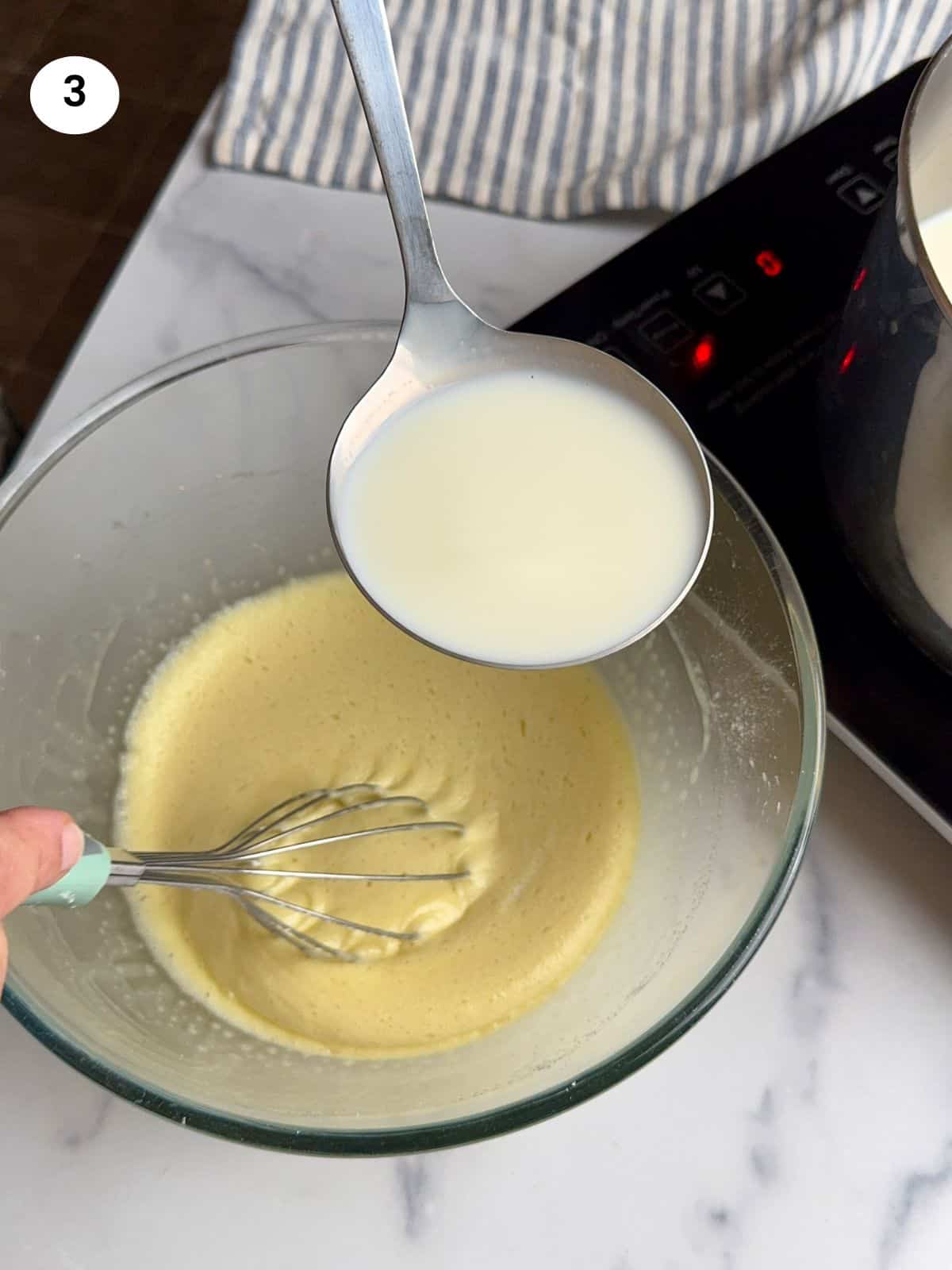 Adding the cornstarch mixture to the pot.