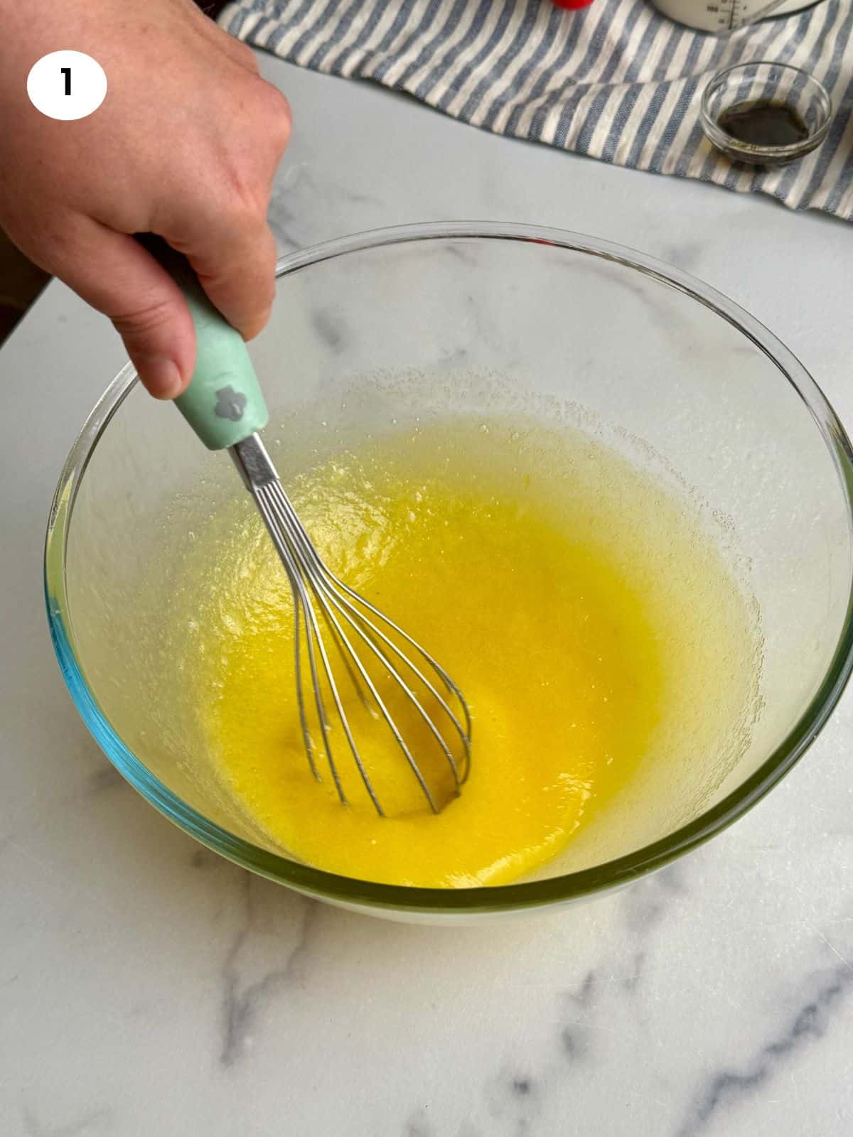 Mixing the eggs and sugar.