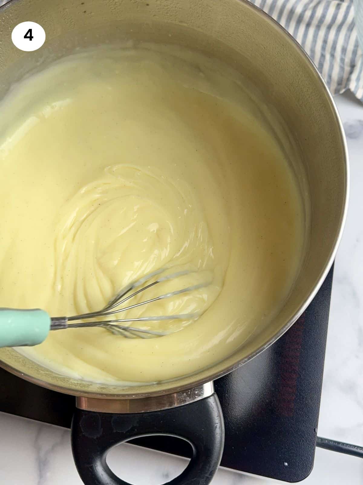 Putting rice pudding to individual bowls.