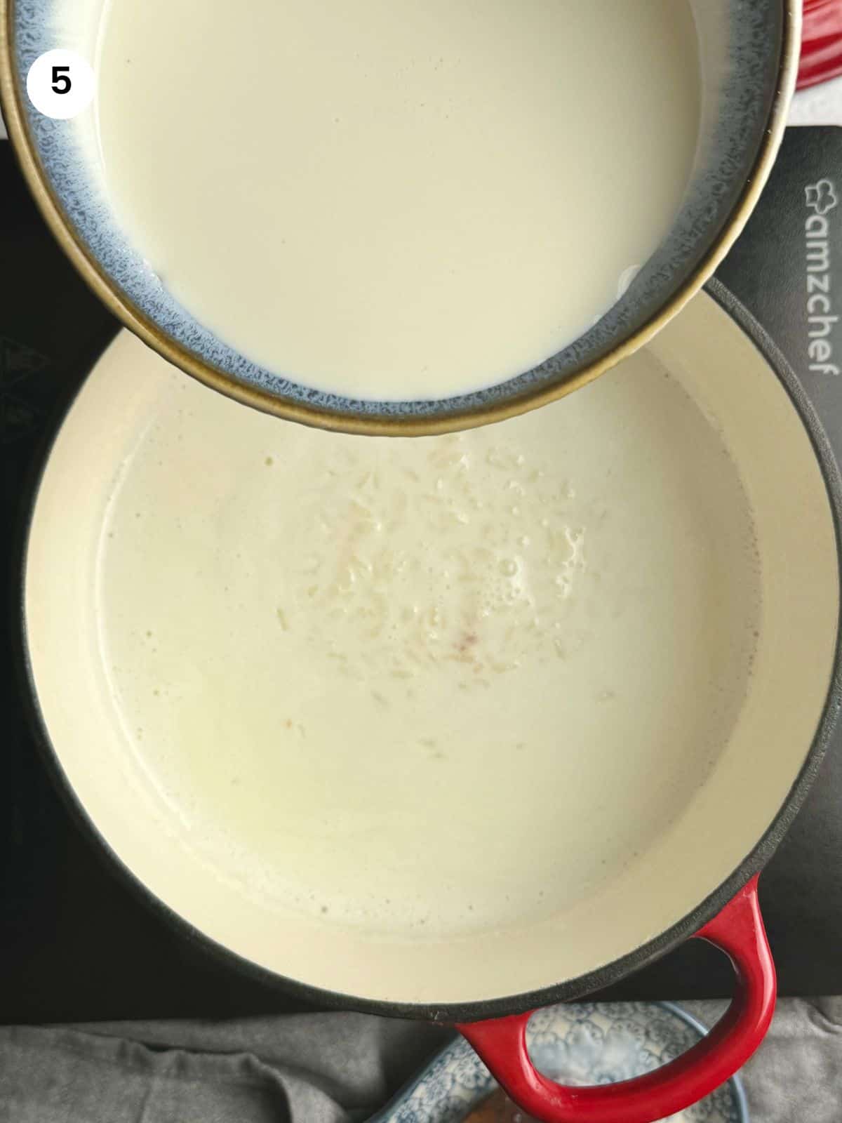 Adding the cornstarch mixture to the pot.