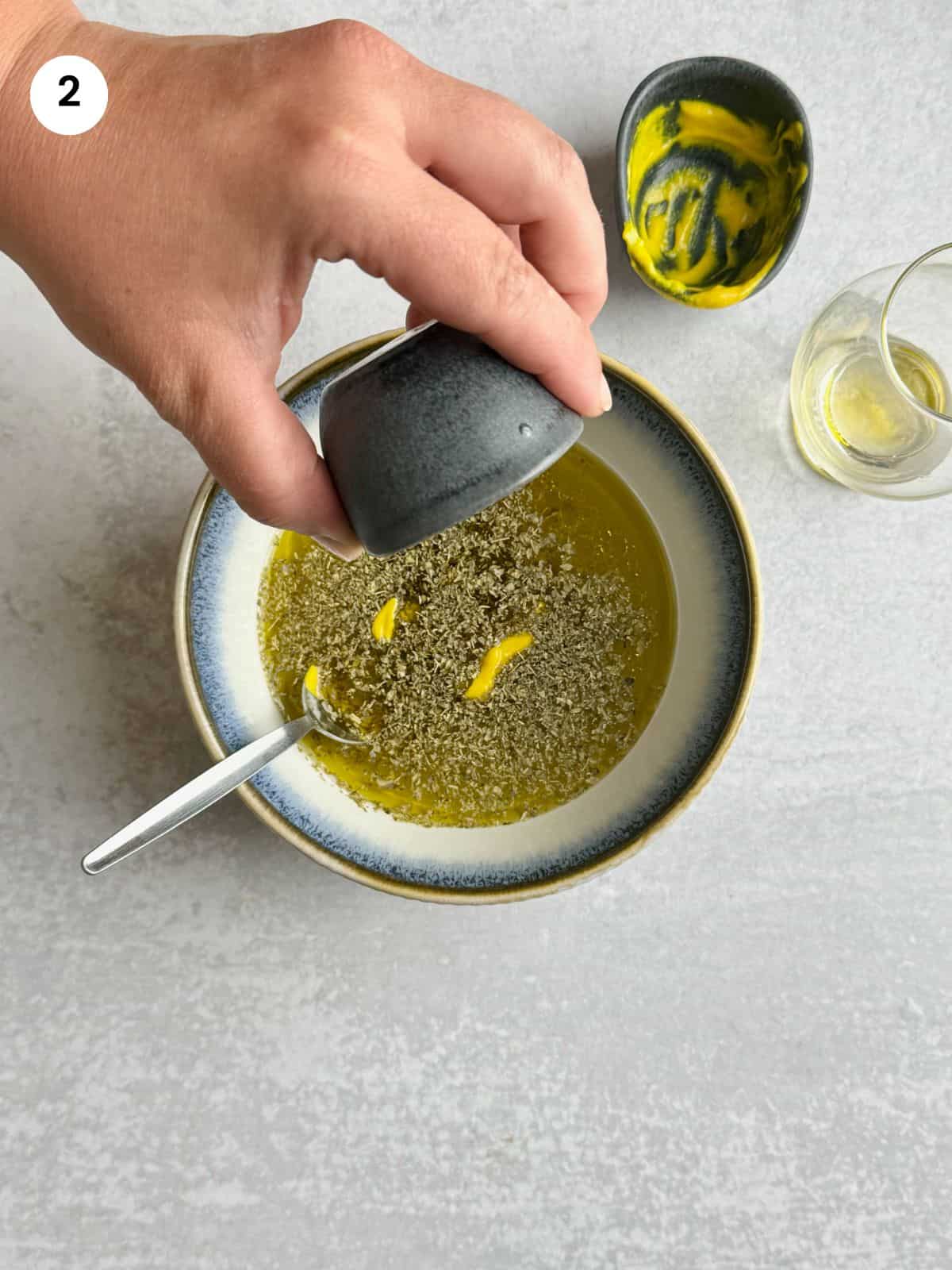 Making the marinade for the lamb and potatoes.