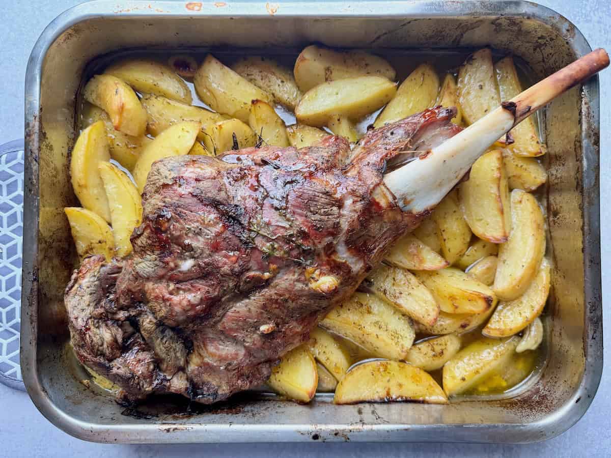 Roasted lamb and potatoes when it is ready and out of the oven.