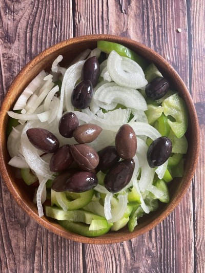 Added kalamata olives to greek salad bowl.