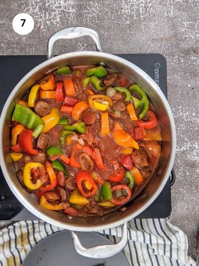 Add chopped tomatoes to the pot.