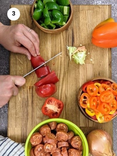 Cutting bell peppers in squares.