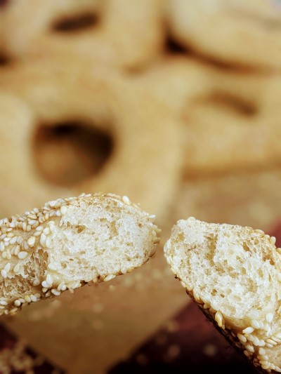 Sesame seeds bagel cut in half.