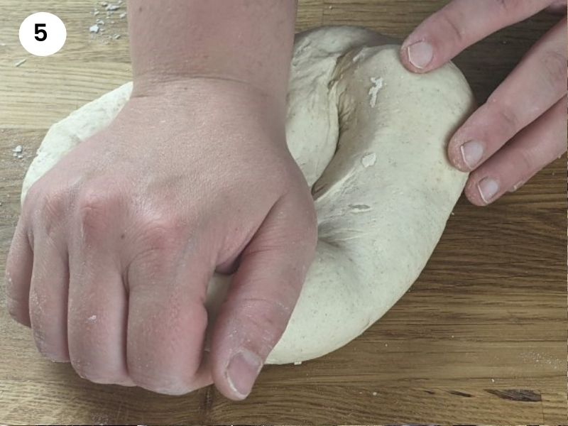 Kneading the dough for greek sesame seed bagels.