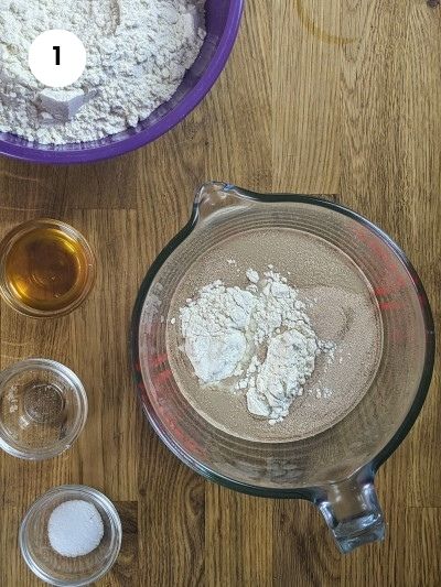 Water, yeast, honey in a bowl to activate yeast.