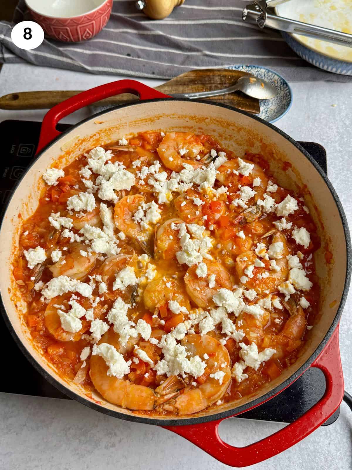 Added the feta cheese on top of the shrimp.