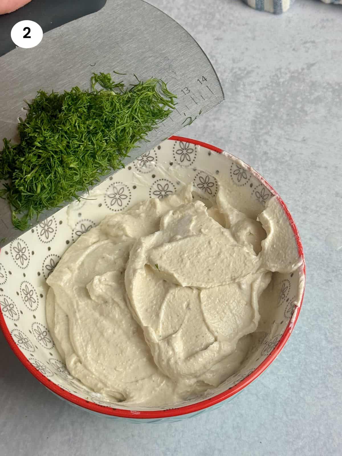 Adding the chopped fresh dill.