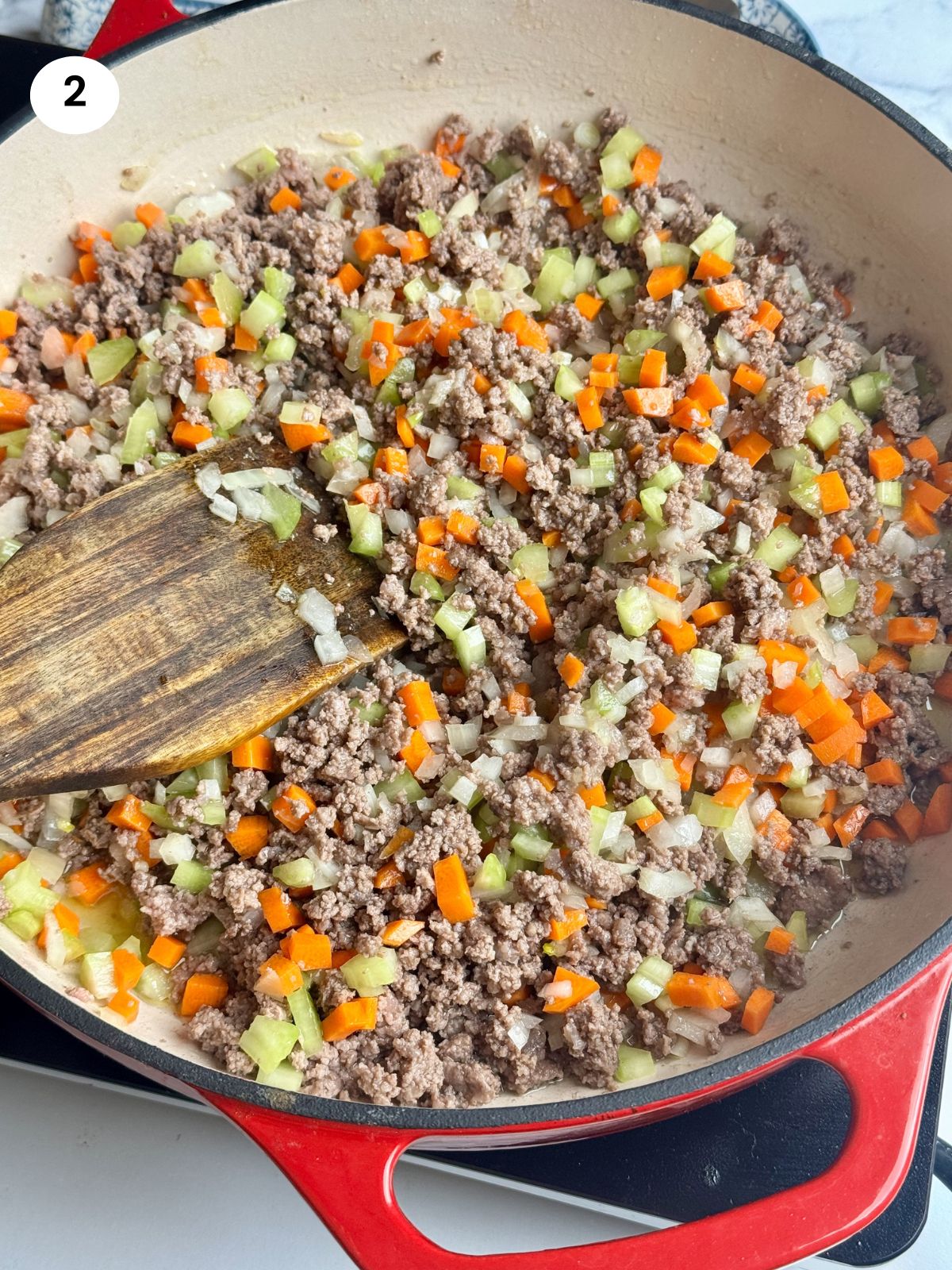 Added the diced carrot and celery to the pan.
