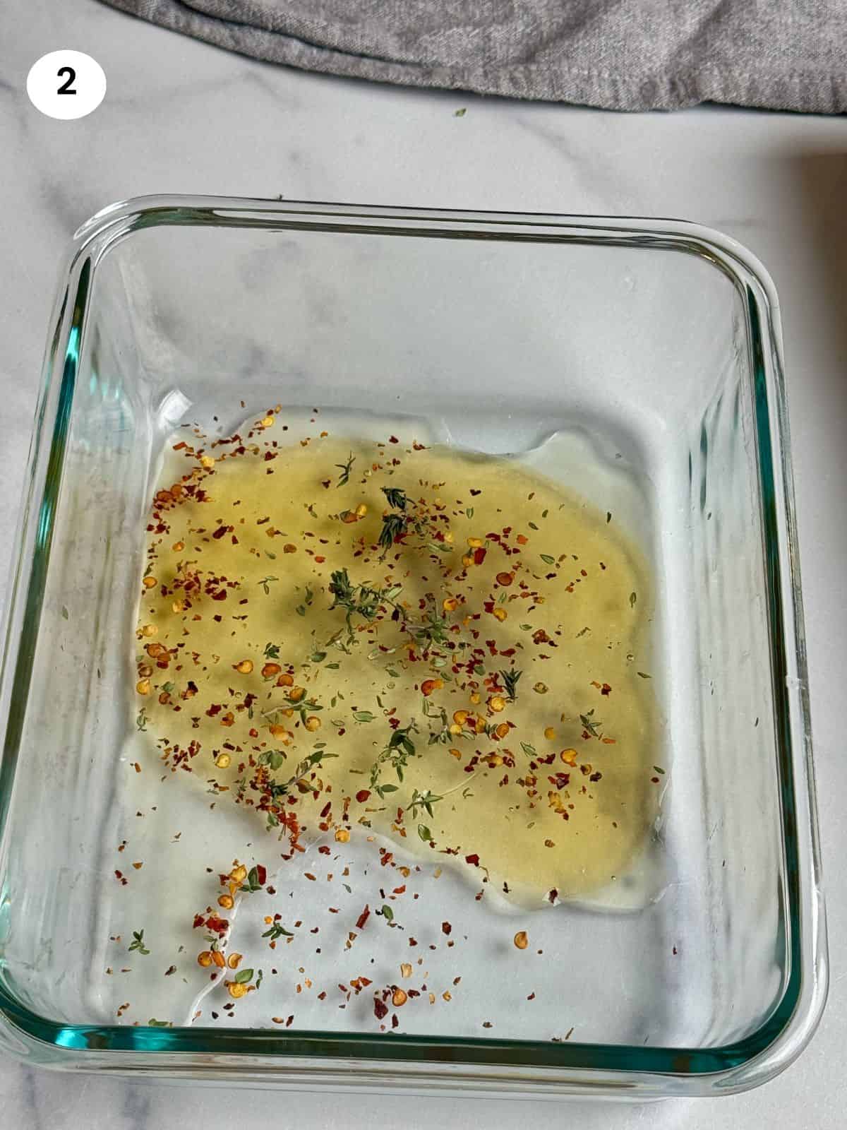 Adding all the ingredients for the halloumi dressing to a bowl.