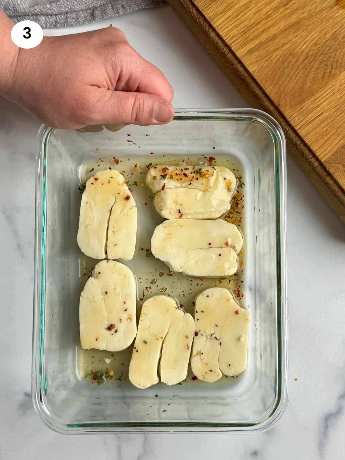 Resting the halloumi in the dressing.