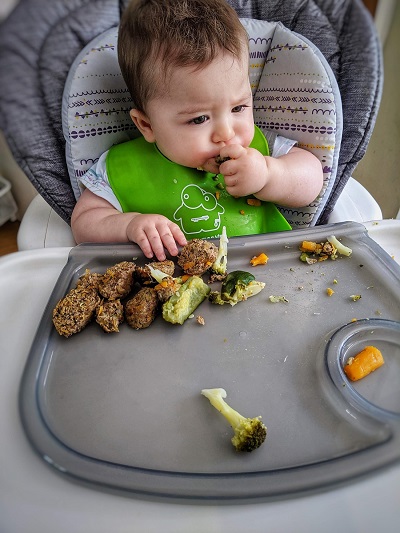 Baby eating finger sized food.