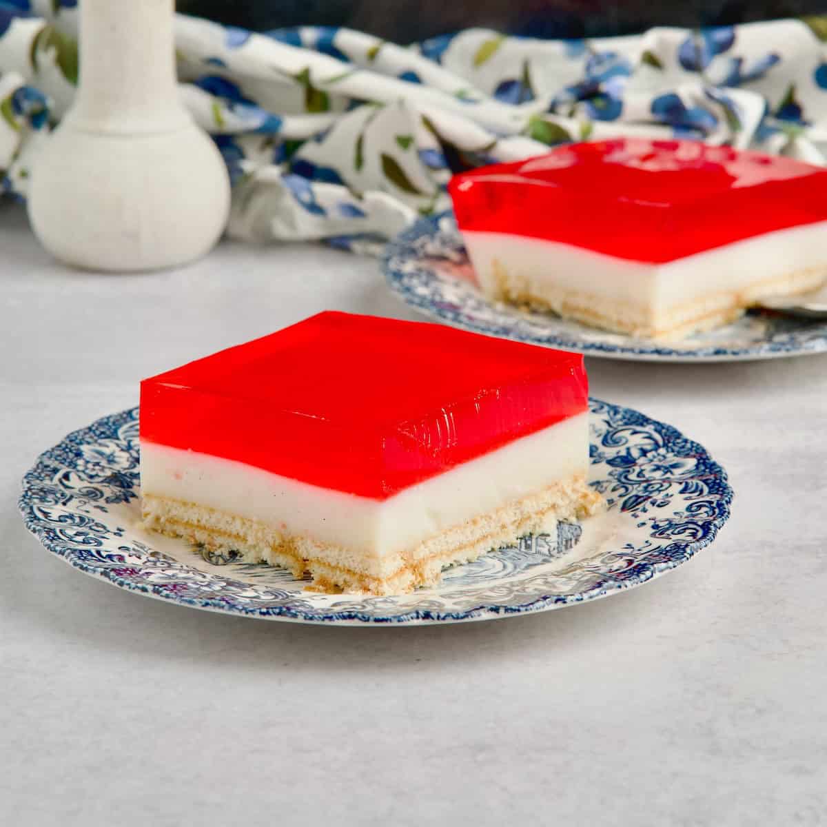 Two slices of jelly and custard dessert on the table.